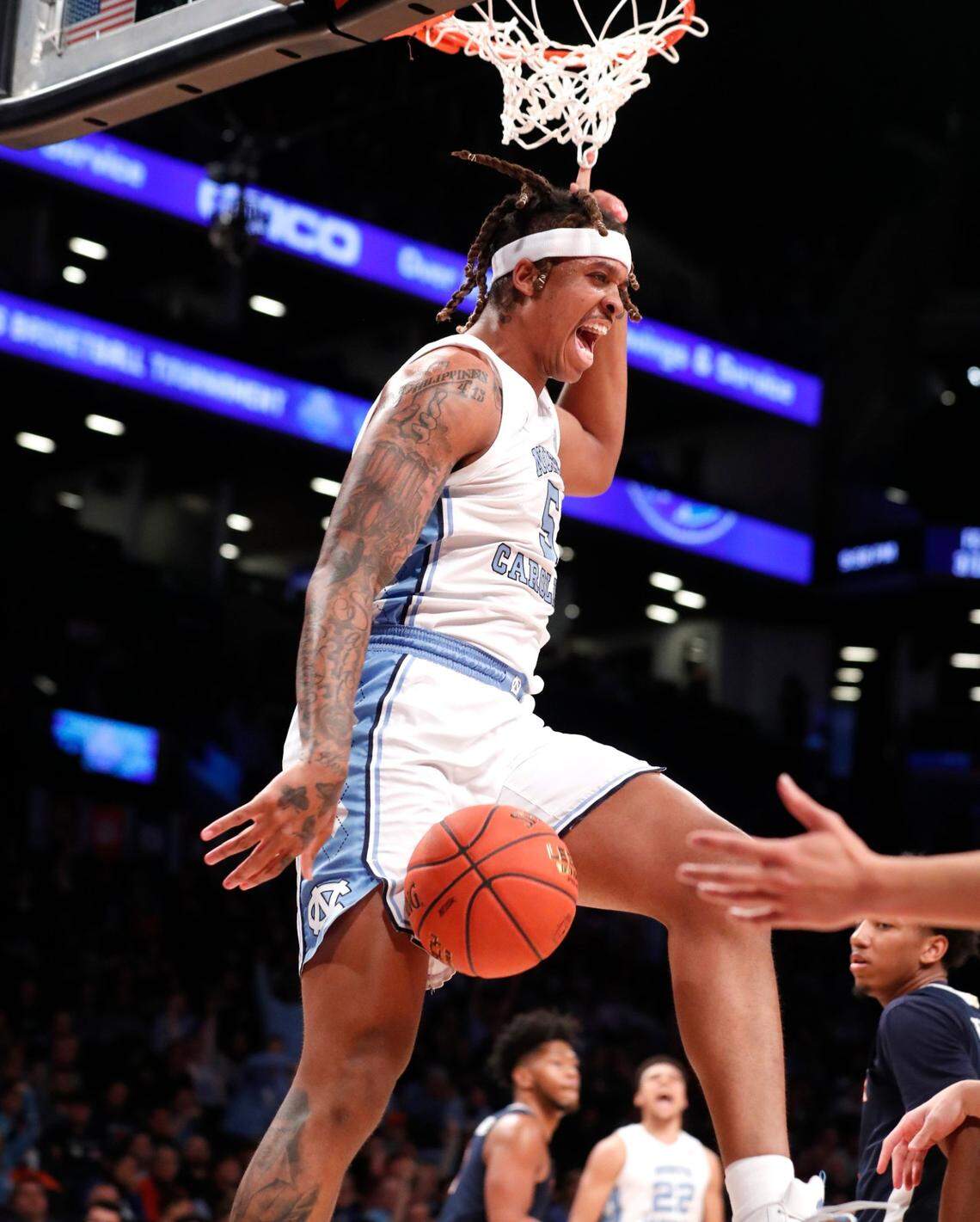 North Carolina’s Armando Bacot (5) reacts after slamming in two during the first half of UNCs game against Virginia in the quarterfinals of the ACC mens basketball tournament at the Barclays Center in Brooklyn, N.Y., Thursday, March 10, 2022.