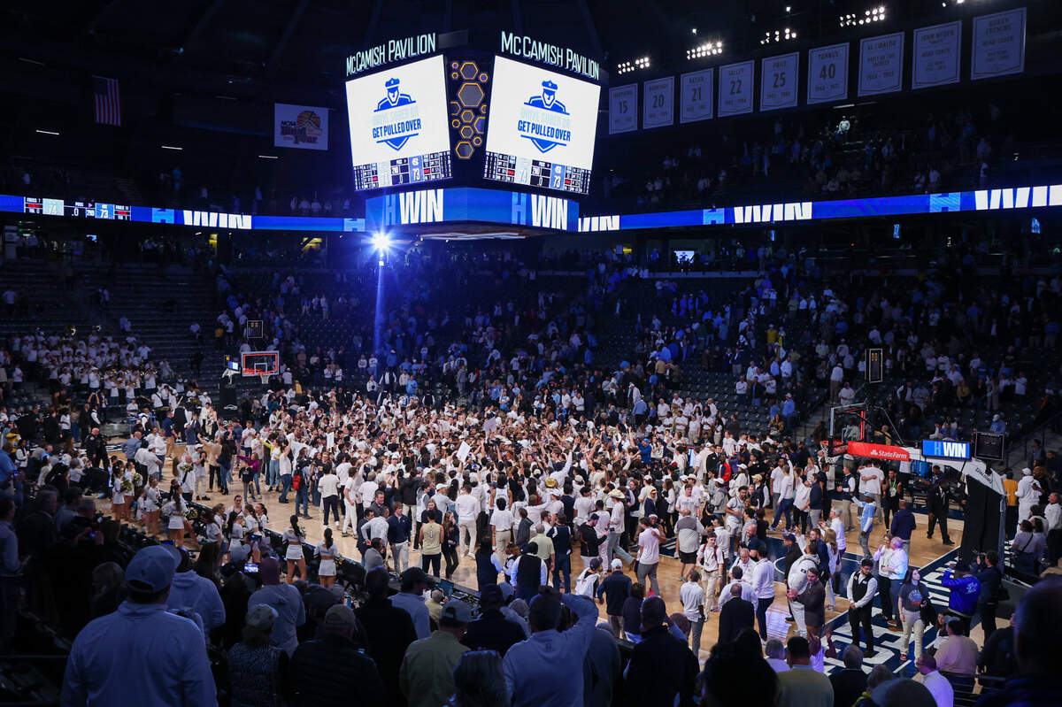 Jan 30, 2024; Atlanta, Georgia, USA; Georgia Tech Yellow Jackets fans rush the court after a victory against the North Carolina Tar Heels at McCamish Pavilion.