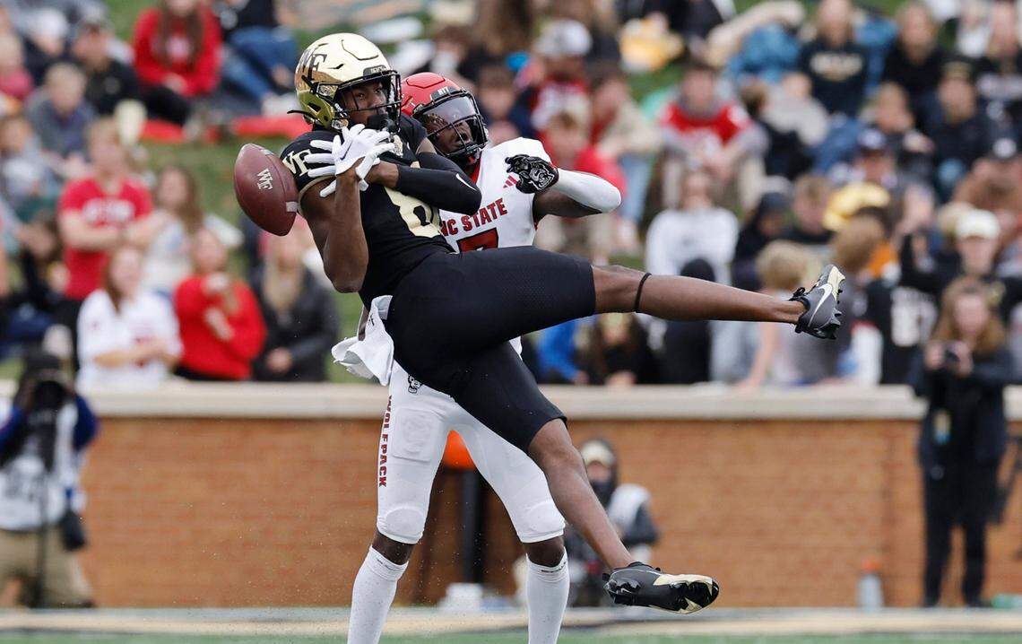 Wake Forest wide receiver Jahmal Banks (80) can’t pull in the pass while defended by N.C. State cornerback Shyheim Battle (7) during the first half of N.C. State’s game against Wake Forest at Allegacy Stadium in Winston-Salem, N.C., Saturday, Nov. 11, 2023.