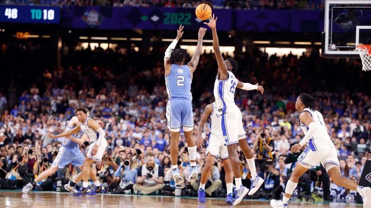North Carolina’s Caleb Love (2) hits a three-pointer with 25 seconds left in the game to give the Tar Heels a 78-74 lead during the second half of UNCs 81-77 victory over Duke in the Final Four at Caesars Superdome in New Orleans, La., Saturday, April 2, 2022. Dukes Mark Williams (15) defends.