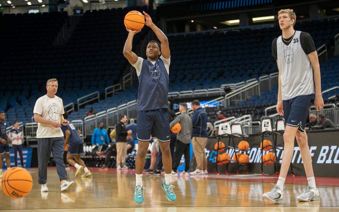 Oral Roberts’ Max Abmas (3), shoots beside 7-5 teammate Connor Vandover (35) during practice on Wednesday, March 15, 2023 at the Amway Center in Orlando, Fla.
