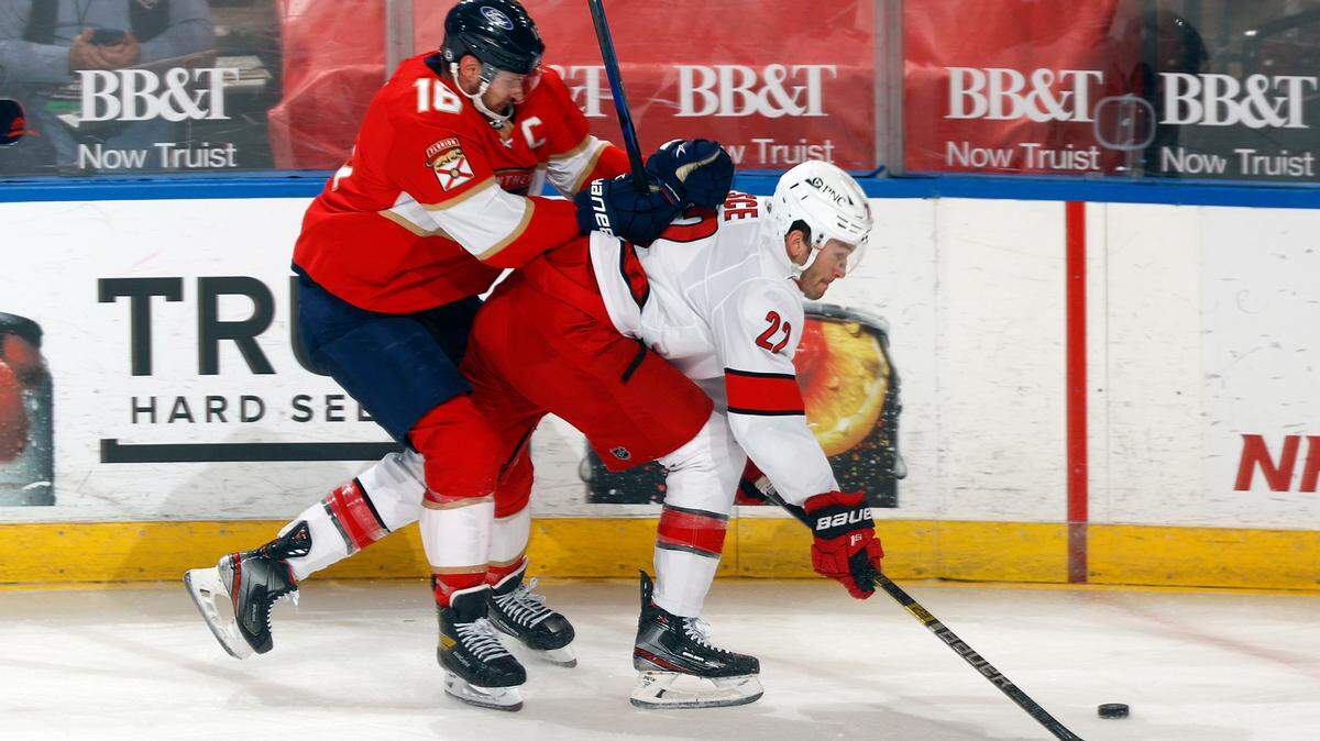 Florida Panthers center Aleksander Barkov (16) defends against Carolina Hurricanes center Nino Niederreiter (21) during the first period of an NHL hockey game Saturday, April 24, 2021, in Sunrise, Fla. (AP Photo/Joel Auerbach)