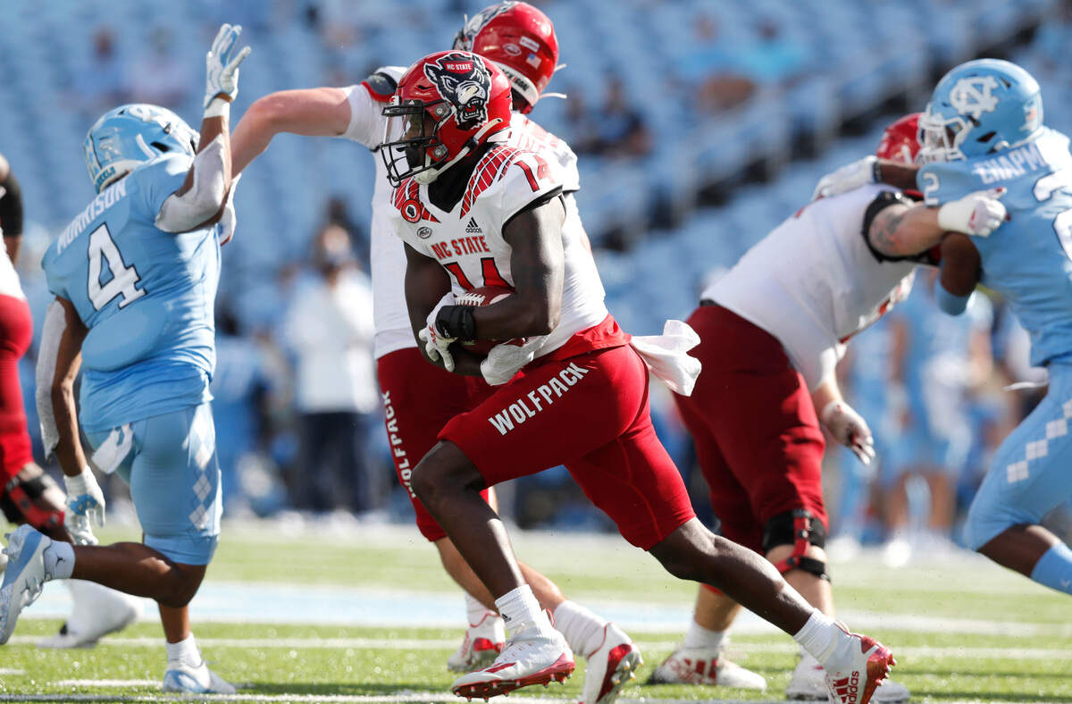 N.C. State wide receiver Porter Rooks (14) runs after catching the ball during the second half of UNC’s 48-21 victory over N.C. State at Kenan Stadium in Chapel Hill, N.C., Saturday, Oct. 24, 2020.