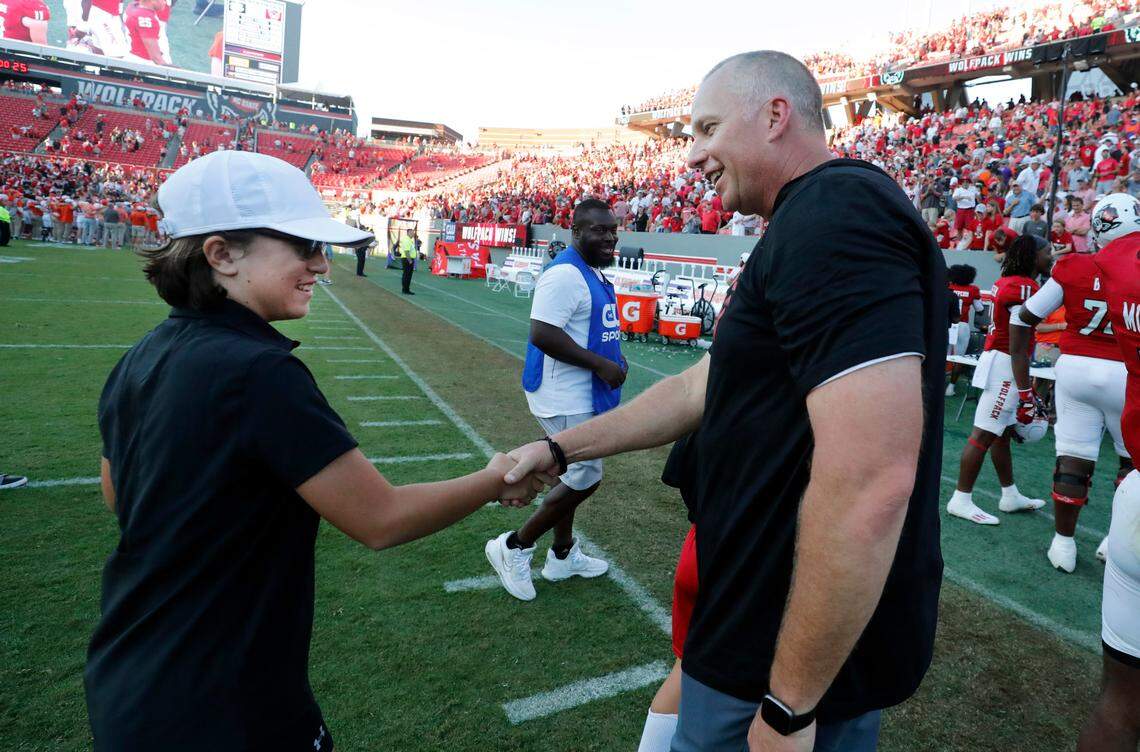 N.C. State head coach Dave Doeren congratulates Payton Gibbs after the Wolfpack’s 24-17 victory over Clemson at Carter-Finley Stadium in Raleigh, N.C., Saturday, Oct. 28, 2023.