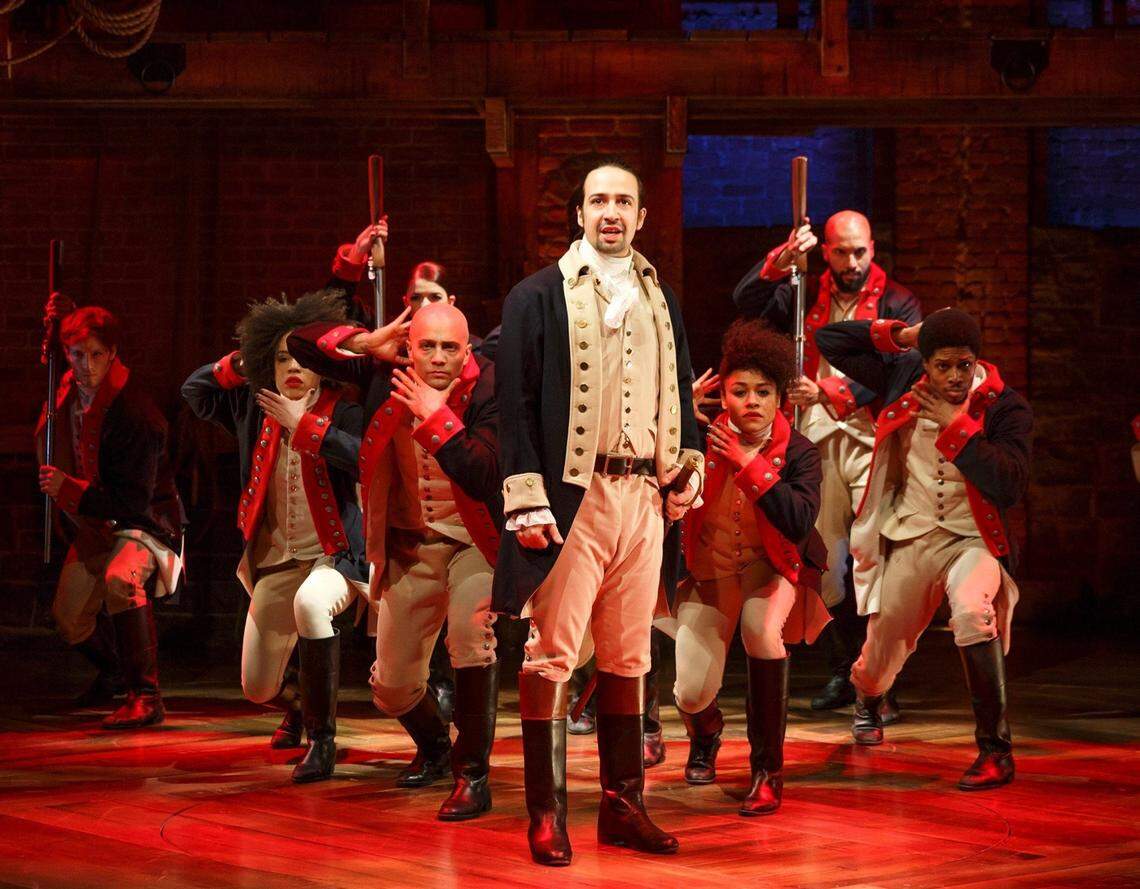 Ariana DeBose, right, with Lin-Manuel Miranda, center, and cast during a performance of “Hamilton,” in New York.
