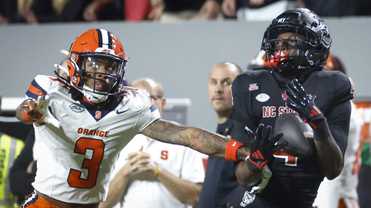 N.C. State wide receiver Dacari Collins (4) can’t pull in the pass while defended by Syracuse defensive back Clarence Lewis (3) during the first half of N.C. State’s game against Syracuse at Carter-Finley Stadium in Raleigh, N.C., Saturday, Oct. 12, 2024.