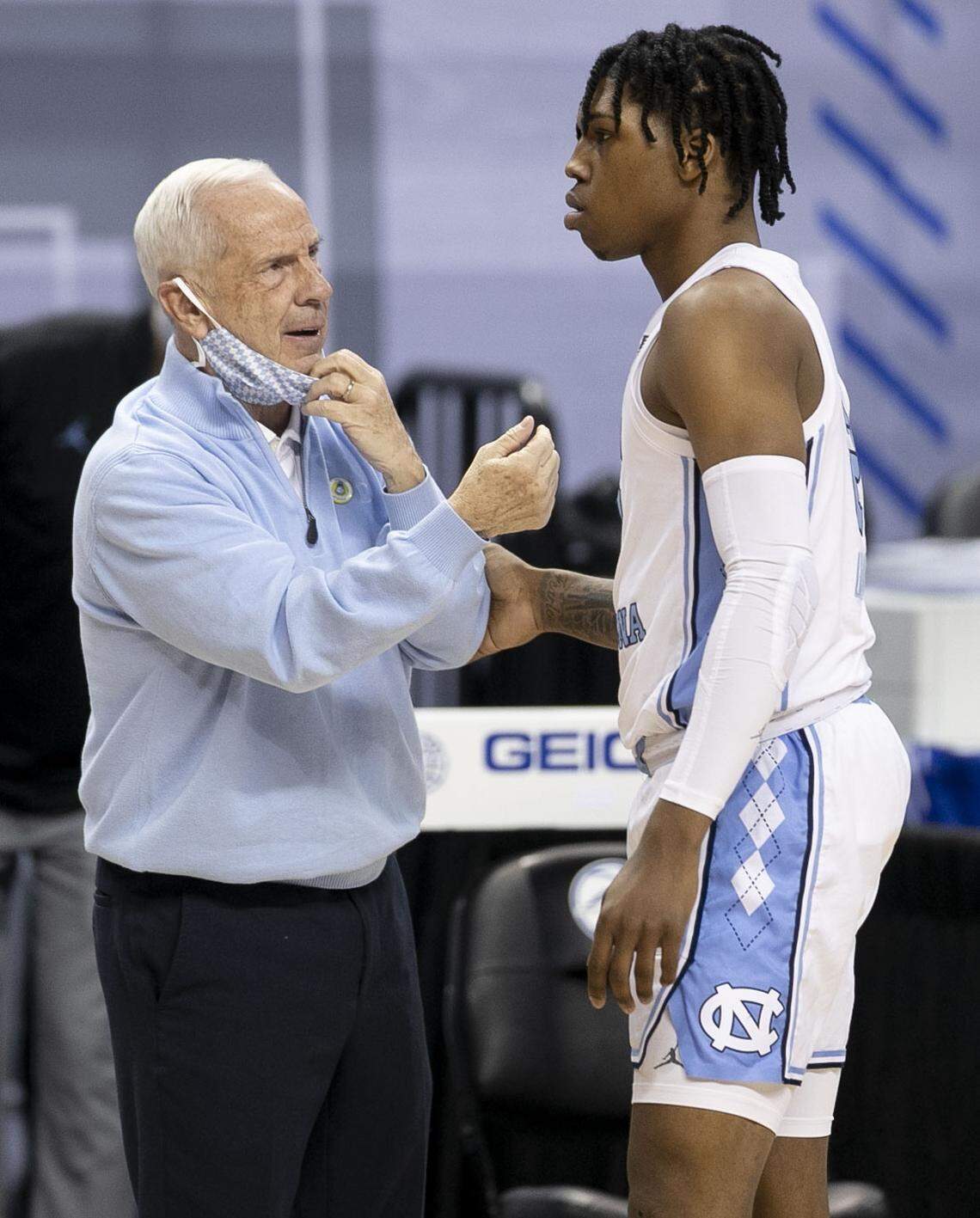 North Carolina coach Roy Williams has a word with Caleb Love (2) during the first half against Notre Dame on Wednesday, March 10, 2021 during the ACC Tournament at the Greensboro Coliseum in Greensboro, N.C.