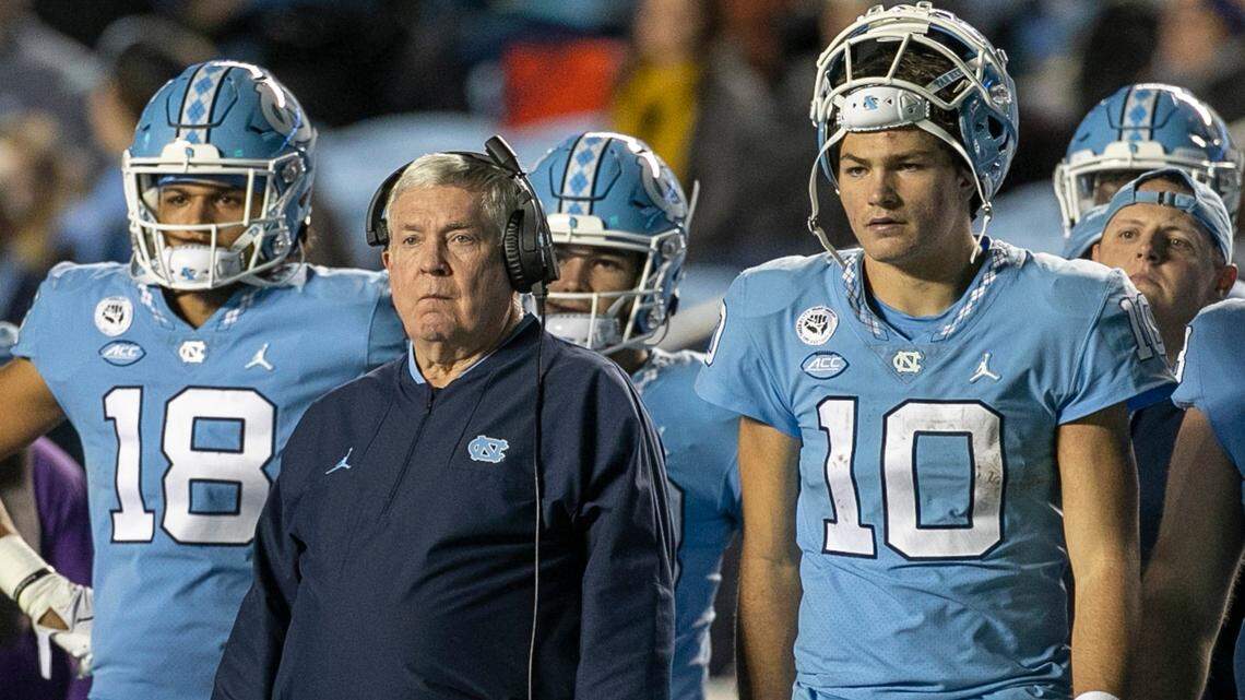 North Carolina quarterback Drake Maye and coach Mack Brown watch the extra point attempt by Noah Burnette to give the Tar Heels a 28-24 lead in the fourth quarter against Pitt on Saturday, October 29, 2022 at Kenan Stadium in Chapel Hill, N.C.