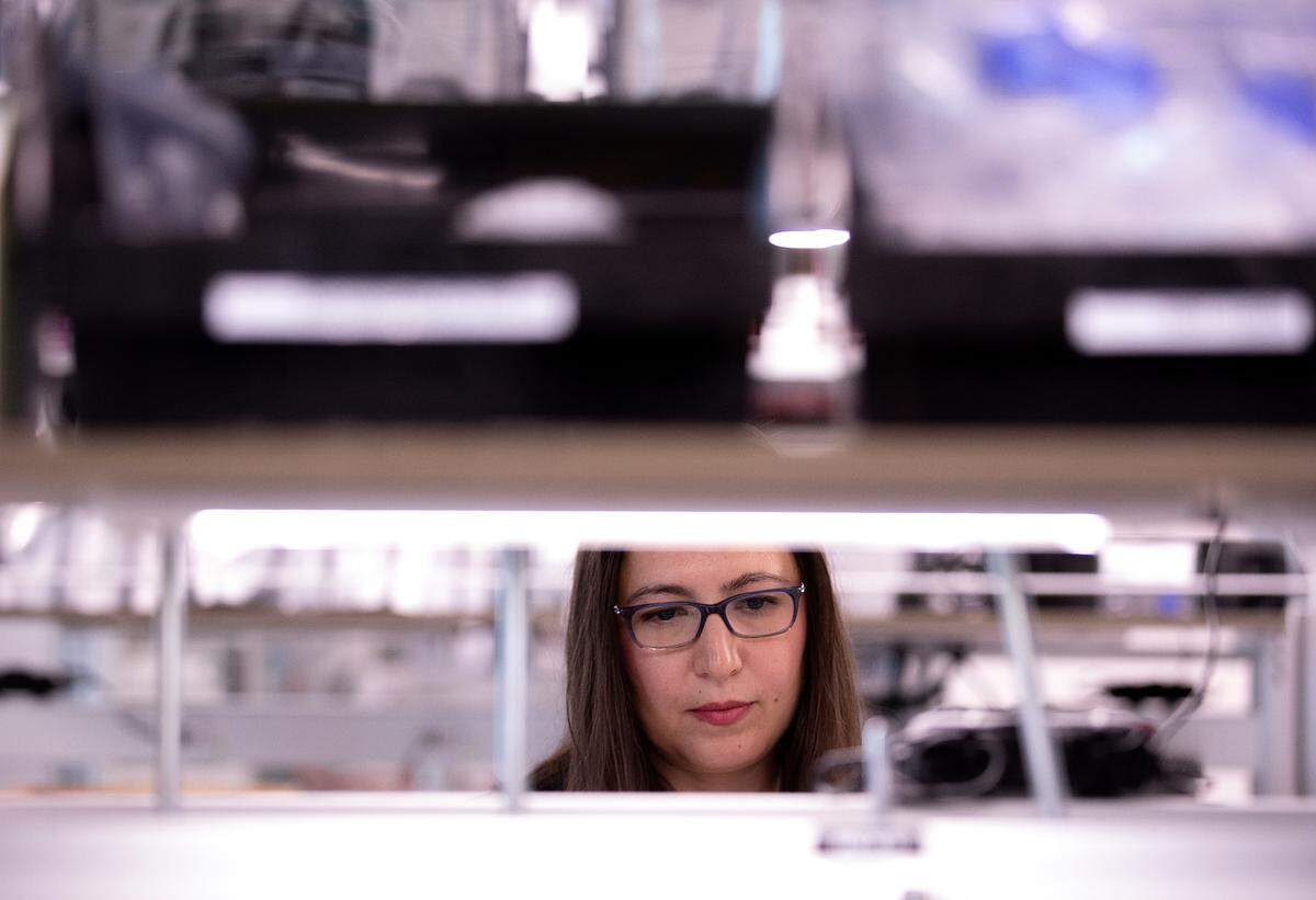 Zehra Parlak, founder of Qatch Technologies, works in the company’s laboratory space on Friday, Dec. 8, 2023, in Durham, N.C.