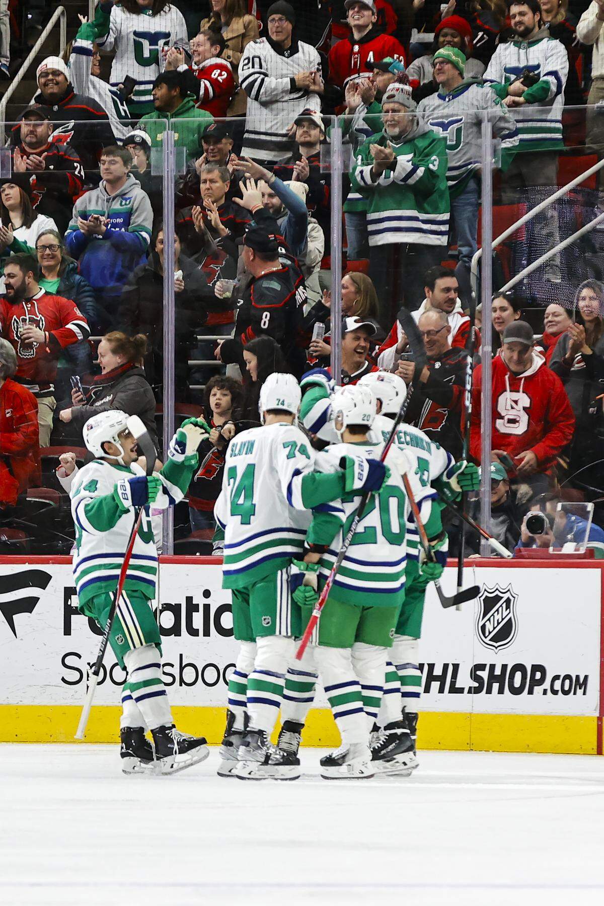 Carolina Hurricanes forward Andrei Svechnikov (37) celebrates his goal with teammates Seth Jarvis (24), Jaccob Slavin (74) and Sebastian Aho (20) during the first period against the Utah Mammoth at Lenovo Center on Jan. 29, 2026 in Raleigh, North Carolina.