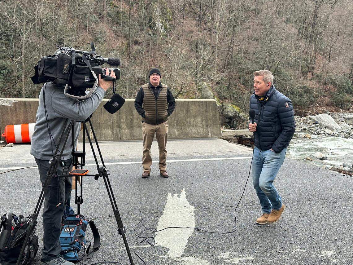 U.S. Transportation Secretary Sean Duffy stamps his feet to try to warm up before doing a Fox News interview from Interstate 40 in Pigeon River Gorge on Monday, Feb. 10, 2025. Duffy, a former host on Fox Business, visited the section of highway that was washed away by floodwaters after Hurricane Helene last fall.