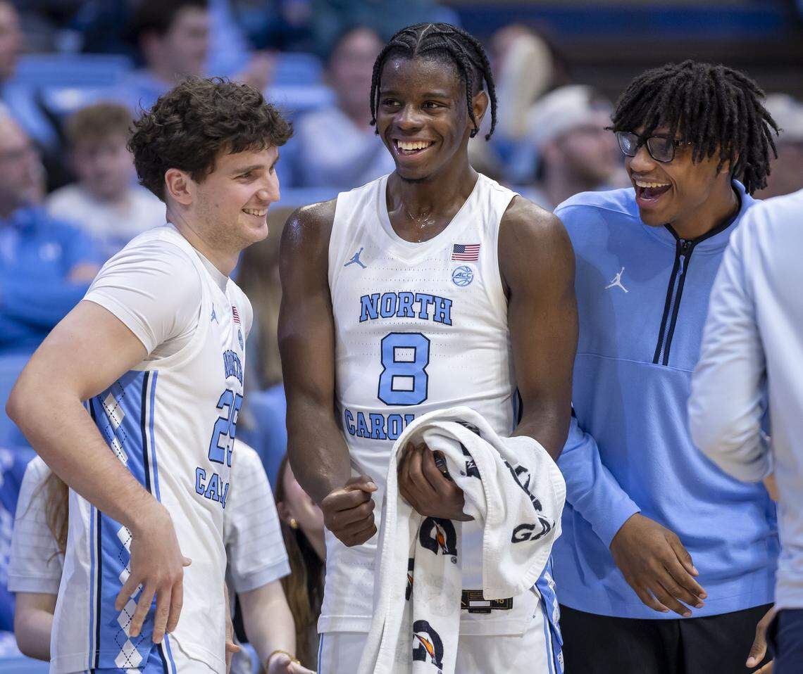 North Carolina forwards Caleb Wilson (8) and James Brown (2) react as reserver player John Holbrook (25) enters the lineup in the closing minutes of play against Notre Dame on Wednesday, January 21, 2026 at the Smith Center in Chapel Hill, N.C. 