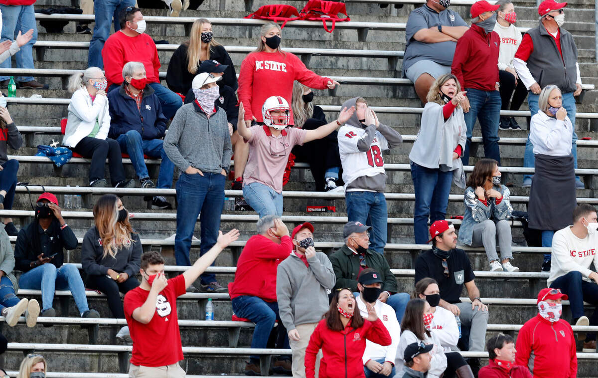 N.C. State fans express their displeasure with the official’s call during the first half of N.C. State’s game against Duke at Carter-Finley Stadium in Raleigh, N.C., Saturday, Oct. 17, 2020.