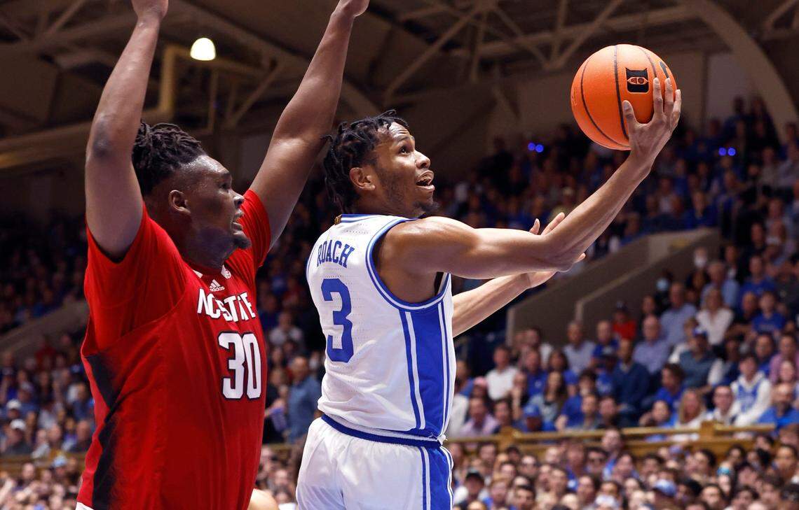 Duke’s Jeremy Roach (3) drives to the basket past N.C. State’s D.J. Burns Jr. (30) during the first half of N.C. State’s game against Duke at Cameron Indoor Stadium in Durham, N.C., Tuesday, Feb. 28, 2023.