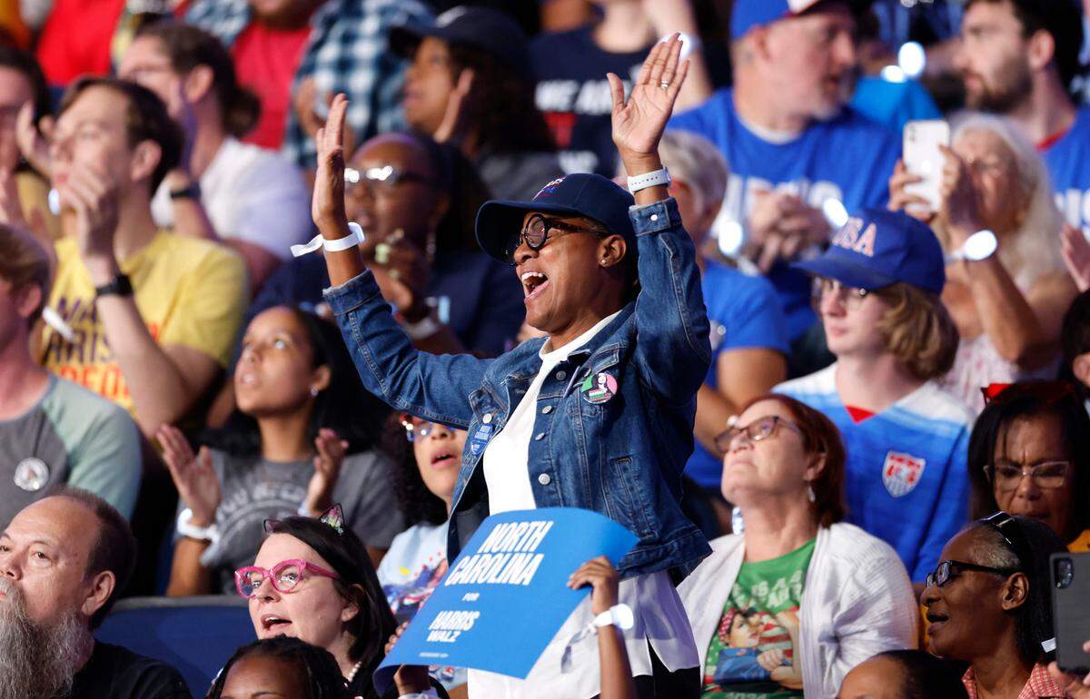 Kamala Harris supporters sing along to the music during a rally for Vice President and democratic nominee for president Kamala Harris at the Greensboro Coliseum in Greensboro, N.C., Thursday, Sept. 12, 2024.