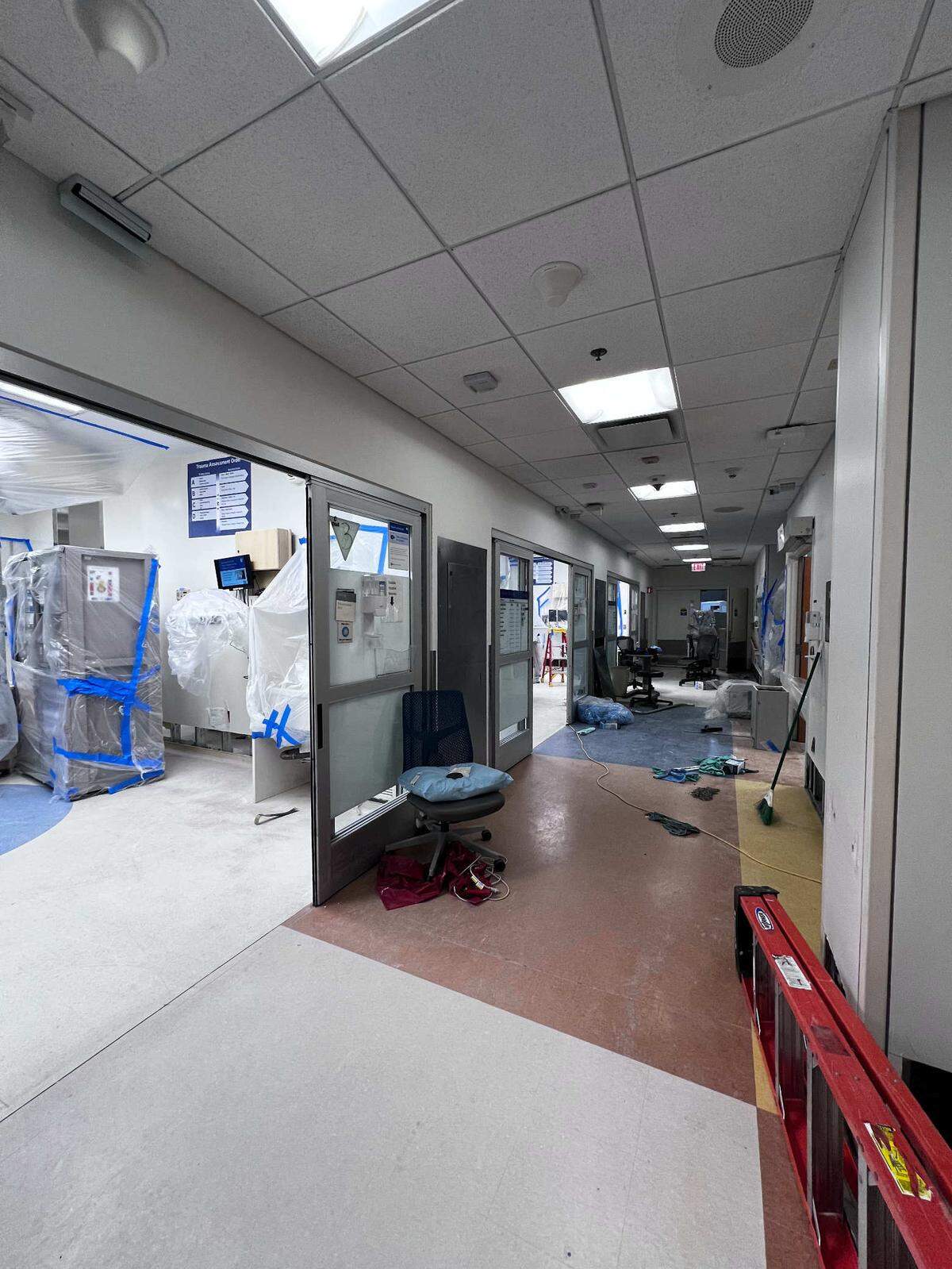 Cleanup from flooding in the hallways and front entrance of the Emergency Department at Duke University Hospital in Durham on Saturday, December 28, 2024.A chilled-water pipe inside a wall burst late Thursday evening causing significant flooding. The ER is temporarily diverting ambulances to nearby hospitals.