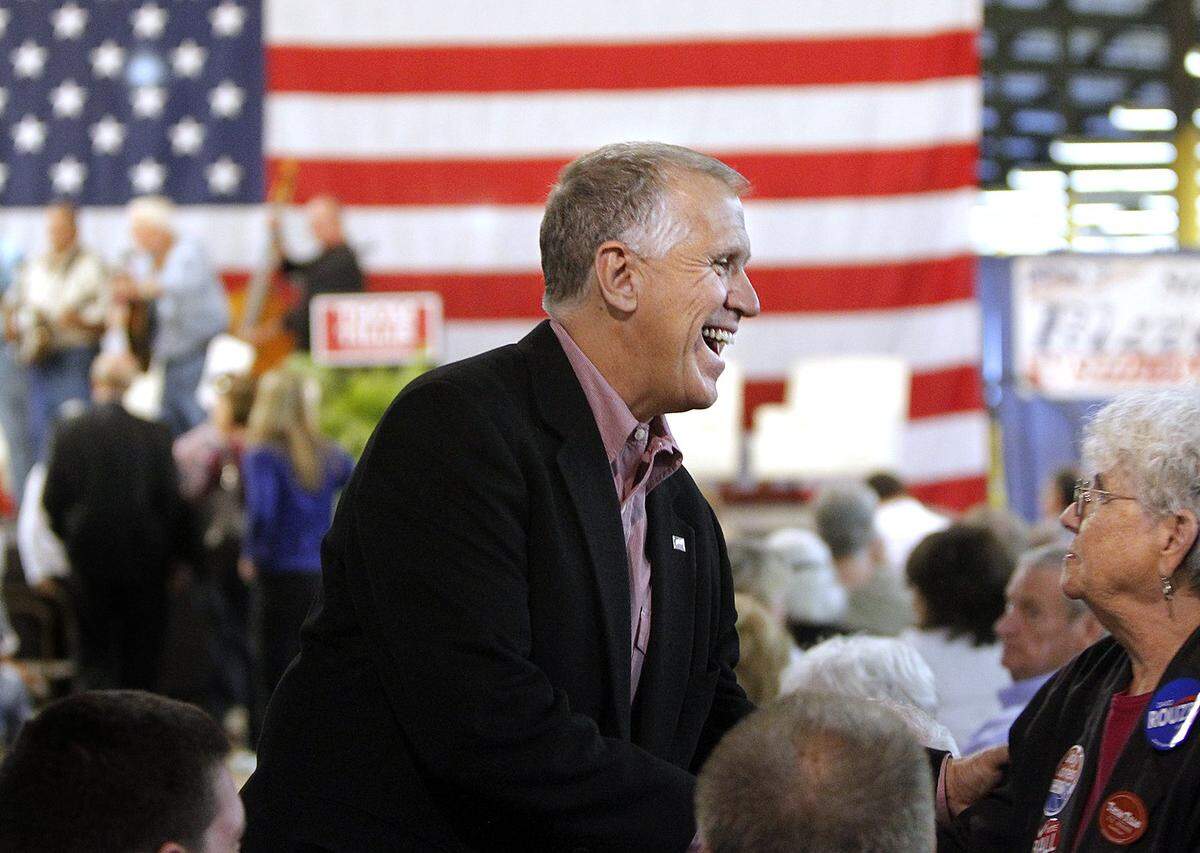 Republican candidate for US Senate Thom Tillis, center greets supporters as Republicans hold The Conservative Rally at the Central Marketing Tobacco Warehouse in Smithfield NC on Oct. 24, 2014. Texas Gov. Rick Perry and NC Sen. Richard Burr were some of the prominent party members there to support Thom Tillis in his US Senate race against Kay Hagan as well as other GOP candidates in various races.