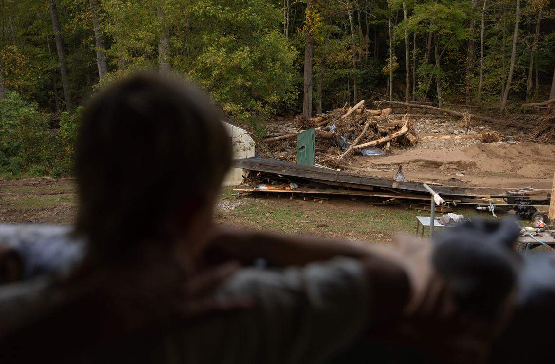 Canaan Ball, 8, looks at his grandmother’s backyard from her porch in Barnardsville, N.C. on Wednesday, October 2, 2024.