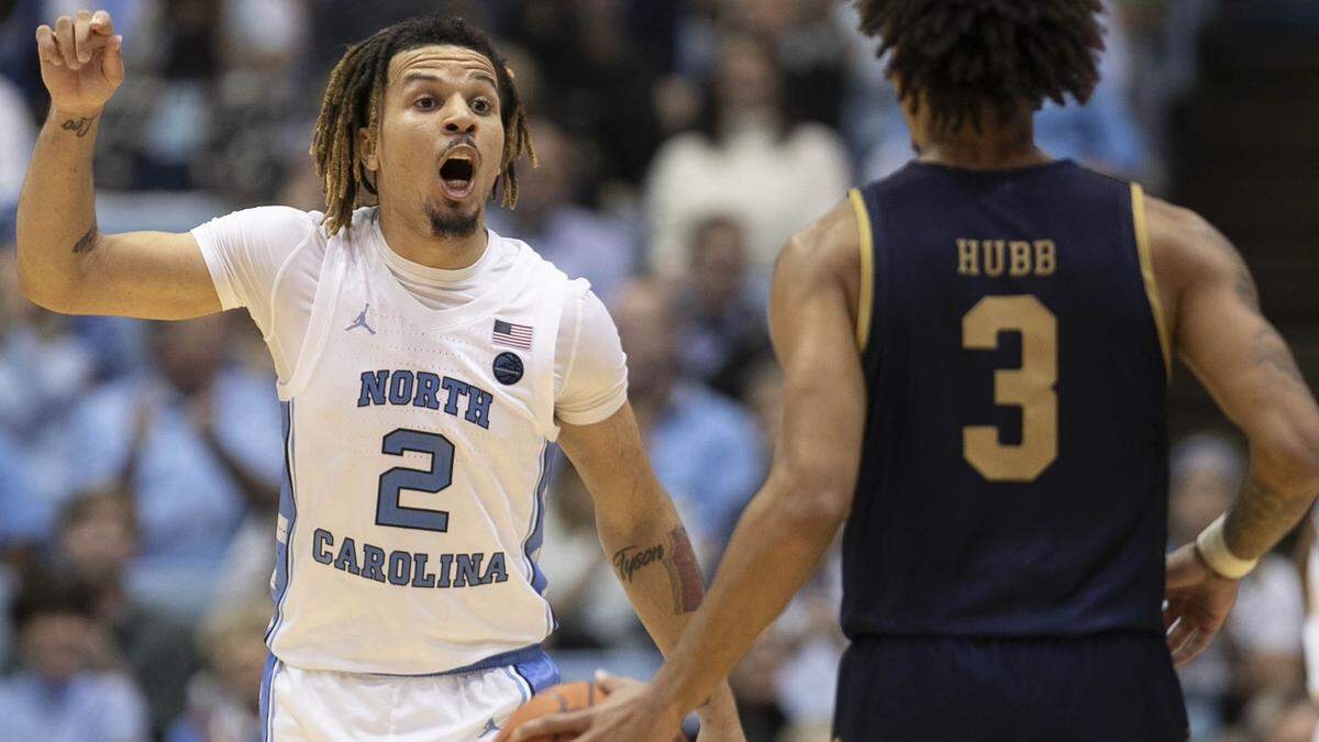 North Carolina’s Cole Anthony (2) rects after a three-point basket in the second half as he defends Notre Dame’s Prentiss Hubb (3) on Wednesday November 6, 2019 at the Smith Center in Chapel Hill, N.C. Anthony lead all scores with 34 points in the Tar Heels’ 76-65 victory.
