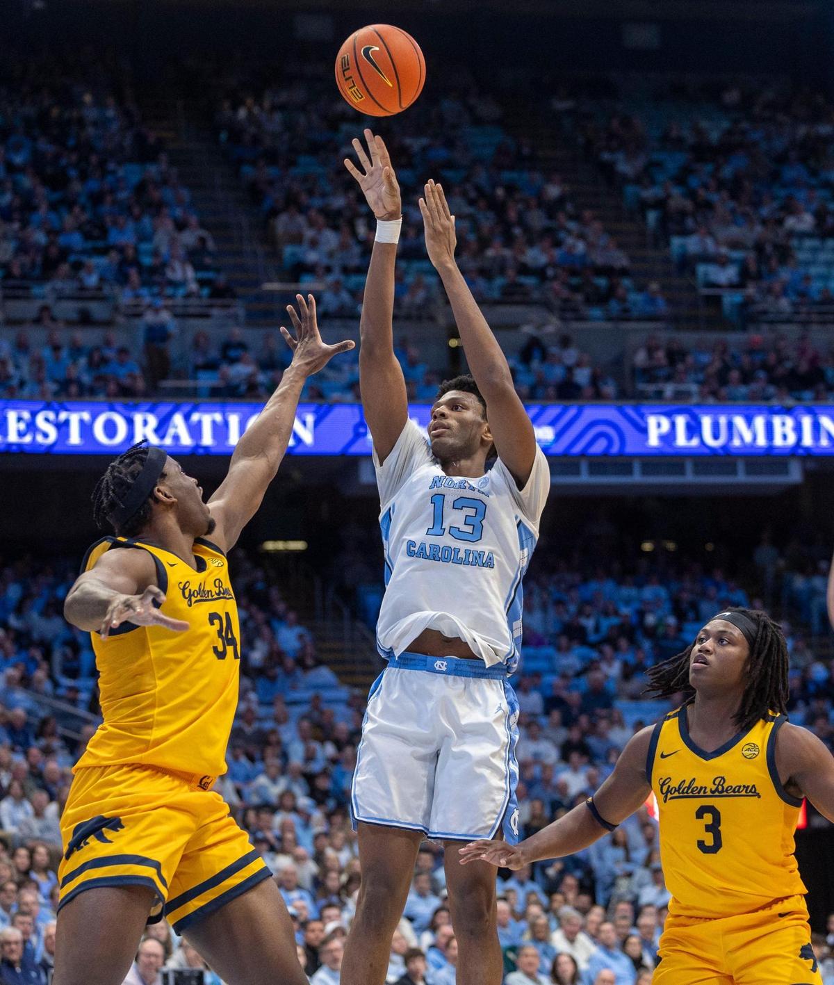 North Carolina forward Jalen Washington (13) puts up a shot against Cal’s Lee Dort (34) in the first half on Wednesday, January 15, 2025 at the Smith Center in Chapel Hill, N.C.