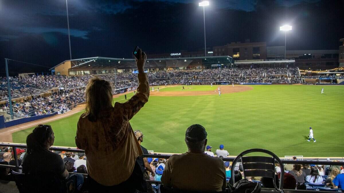 Fans cheer as the Durham Bulls play their season opener against the Jacksonville Jumbo Shrimp at the Durham Bulls Athletic Park, Tuesday, April 12, 2022.