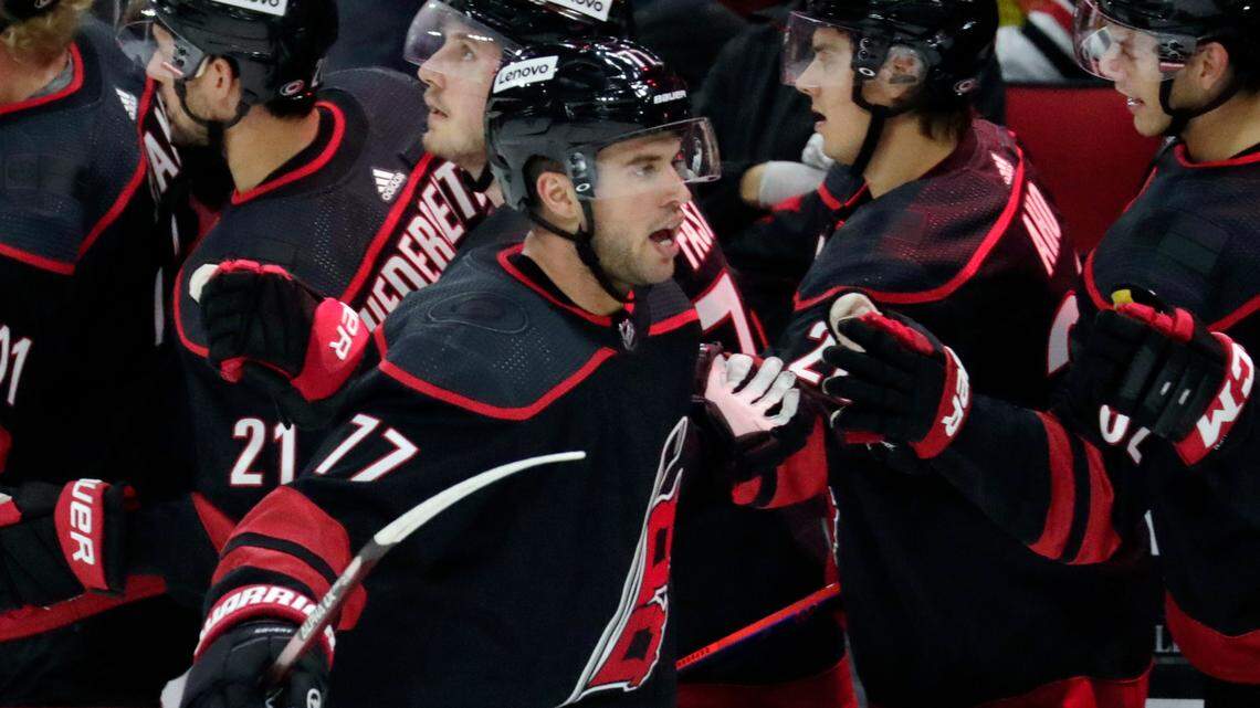 Carolina Hurricanes defenseman Tony DeAngelo (77) celebrates his goal as he comes back to the bench during the first period of an NHL hockey game against the Chicago Blackhawks Friday, Oct. 29, 2021, in Raleigh, N.C. (AP Photo/Chris Seward)