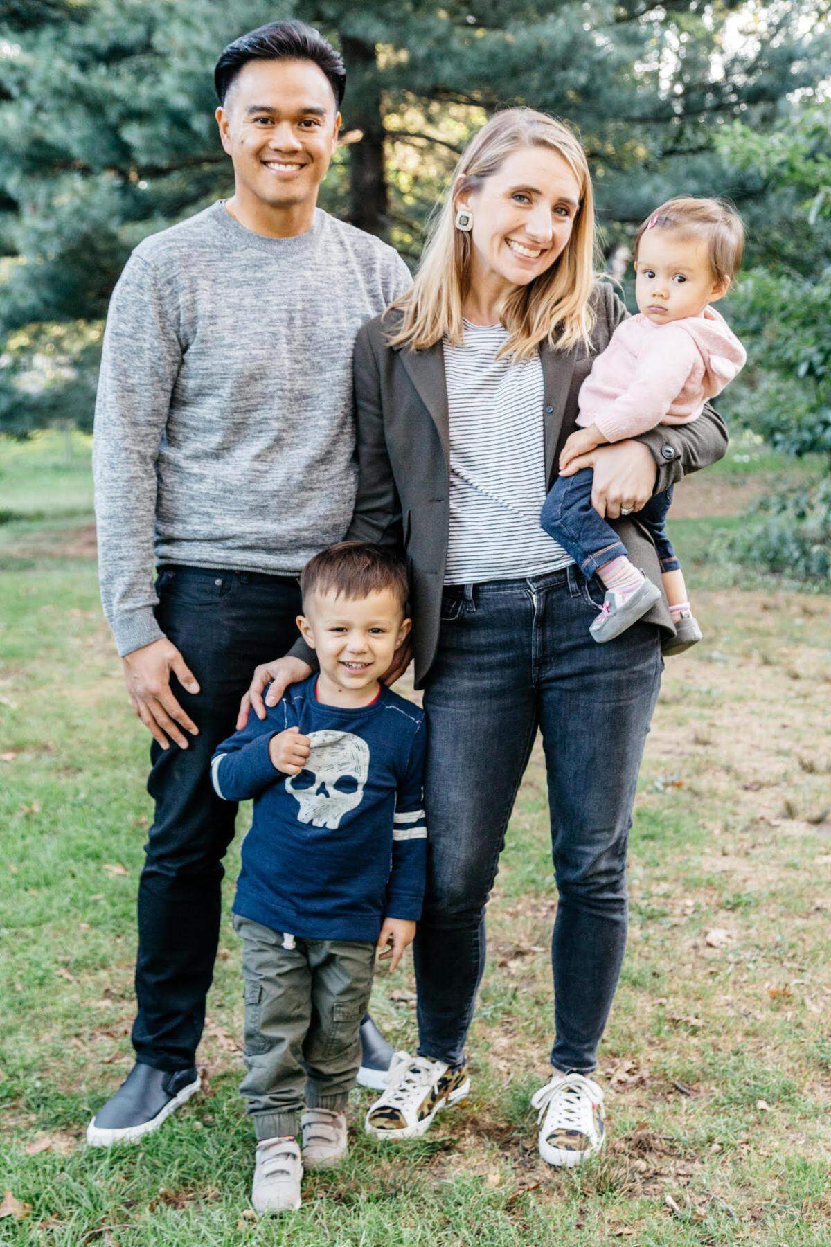Matthew and Brooke Navarro, the co-founders of Without a Trace Foods, stand with their two children.