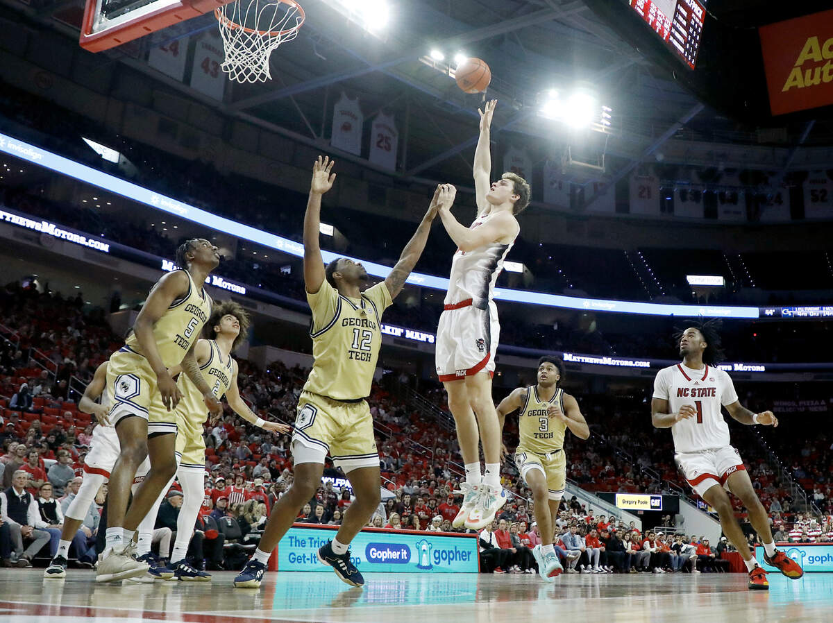 N.C. State’s Ben Middlebrooks shoots over Georgia Tech’s Tyzhaun Claude during the second half of the Wolfpack’s 82-76 win on Saturday, Feb. 3, 2024, at PNC Arena in Raleigh, N.C.