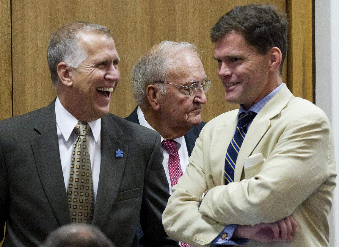 Speaker of the House Thom Tillis, left, enjoys a laugh with Rep. Grier Martin as the budget bill is debated on the NC House floor at the Legislature in August 2014.