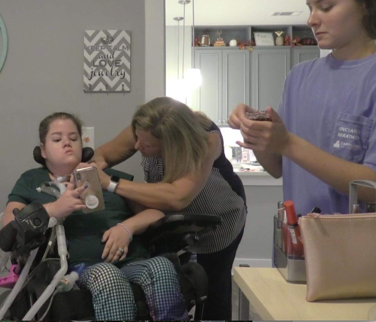 Megan Crowley was diagnosed with Pompe, a rare gentic disease, as a child and requires 24-hour care. A nurse helps her get ready for her day as a graduate student at UNC-Chapel Hill, where she hopes to earn a degree in social work.