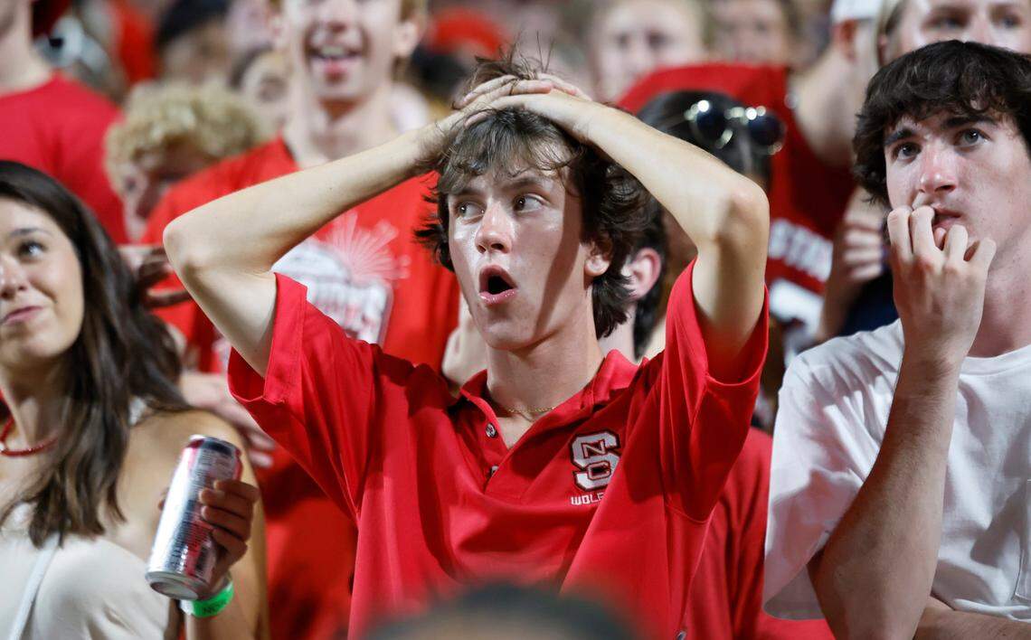 Wolfpack fans can’t believe the play during the first half of N.C. State’s game against Western Carolina at Carter-Finley Stadium in Raleigh, N.C., Thursday, August 29, 2024.