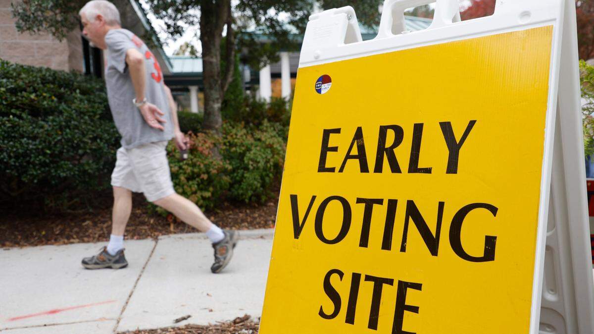 Voters head into the early voting site at the Cary Senior Center in Cary, N.C., on Friday, Oct. 28, 2022.