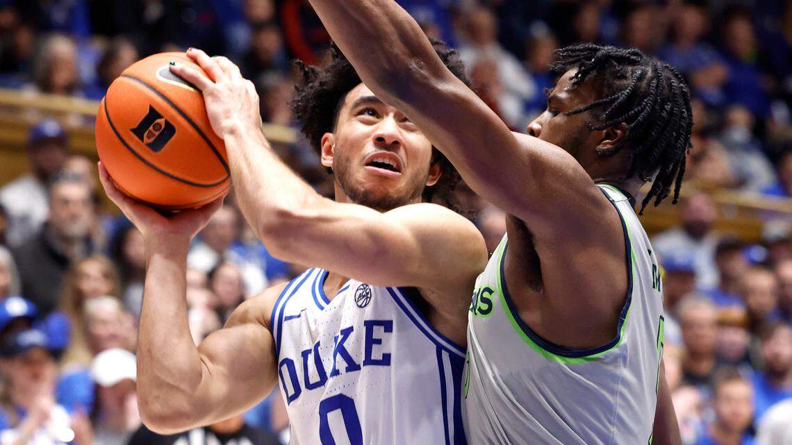 Duke’s Jared McCain (0) drives past Queens’ AJ McKee (5) during the second half of Duke’s 106-69 victory over Queens University at Cameron Indoor Stadium in Durham, N.C., Saturday, Dec. 30, 2023.