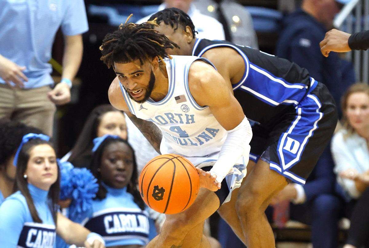 North Carolina’s RJ Davis (4) steals the ball from Duke’s Jeremy Roach (3) during the first half of UNC’s game against Duke at the Smith Center in Chapel Hill, N.C., Saturday, March 4, 2023.
