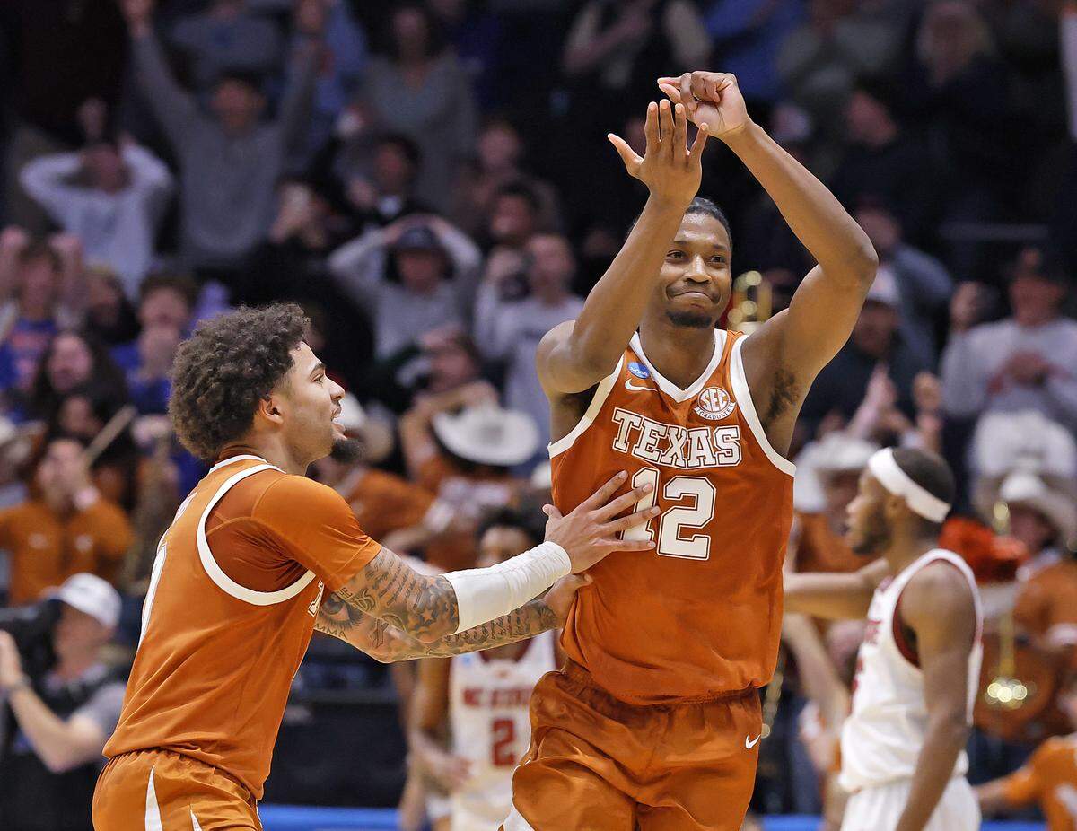 Texas’ Tramon Mark, right, reacts after scoring with seconds remaining to cement the Longhorns’ 68-66 win over N.C. State in the NCAA First Four on Tuesday, March 17, 2026, at the University of Dayton Arena in Dayton, Ohio.