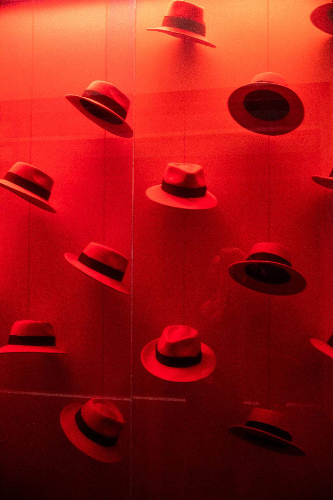 Red fedoras are on display inside Red Hat’s office building in Raleigh.