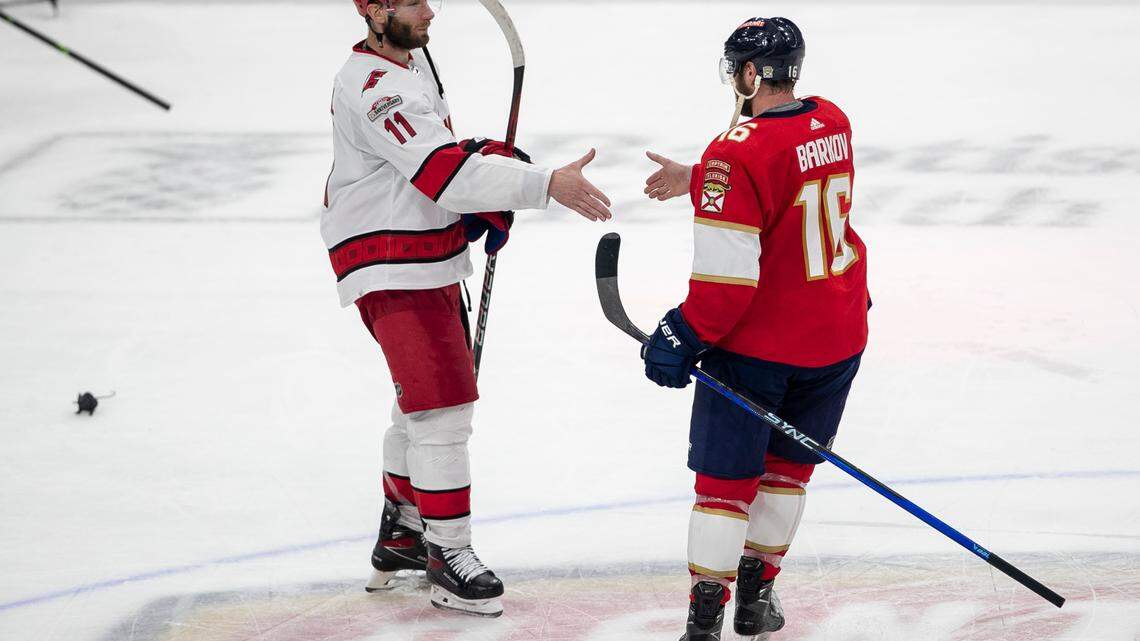 The Carolina Hurricanes Jordan Staal (11) begins the handshake line by congratulating the Florida Panthers Aleksander Barkov (16) following the Panthers’ 4-3 victory, clinching the Eastern Conference Finals, on Wednesday, May 24, 2023 at FLA Live Arena in Sunrise, Fla.