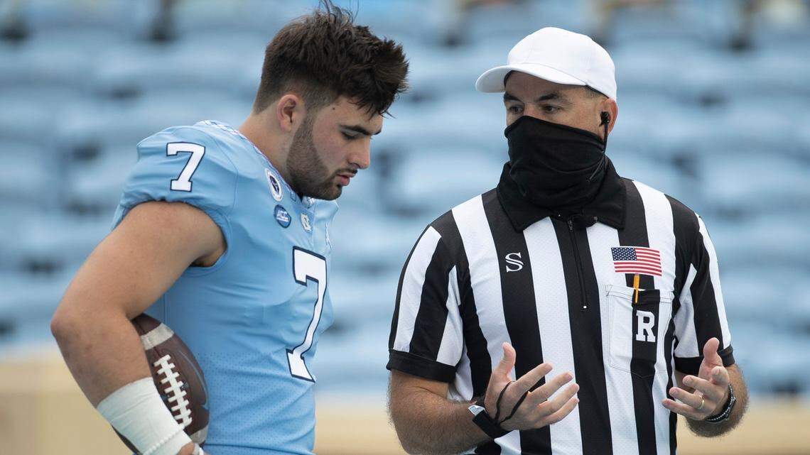 North Carolina quarterback Sam Howell (7) confers with an official prior to the Tar Heel’s game against Syracuse on Saturday, September 12, 2020 in Chapel Hill, N.C.