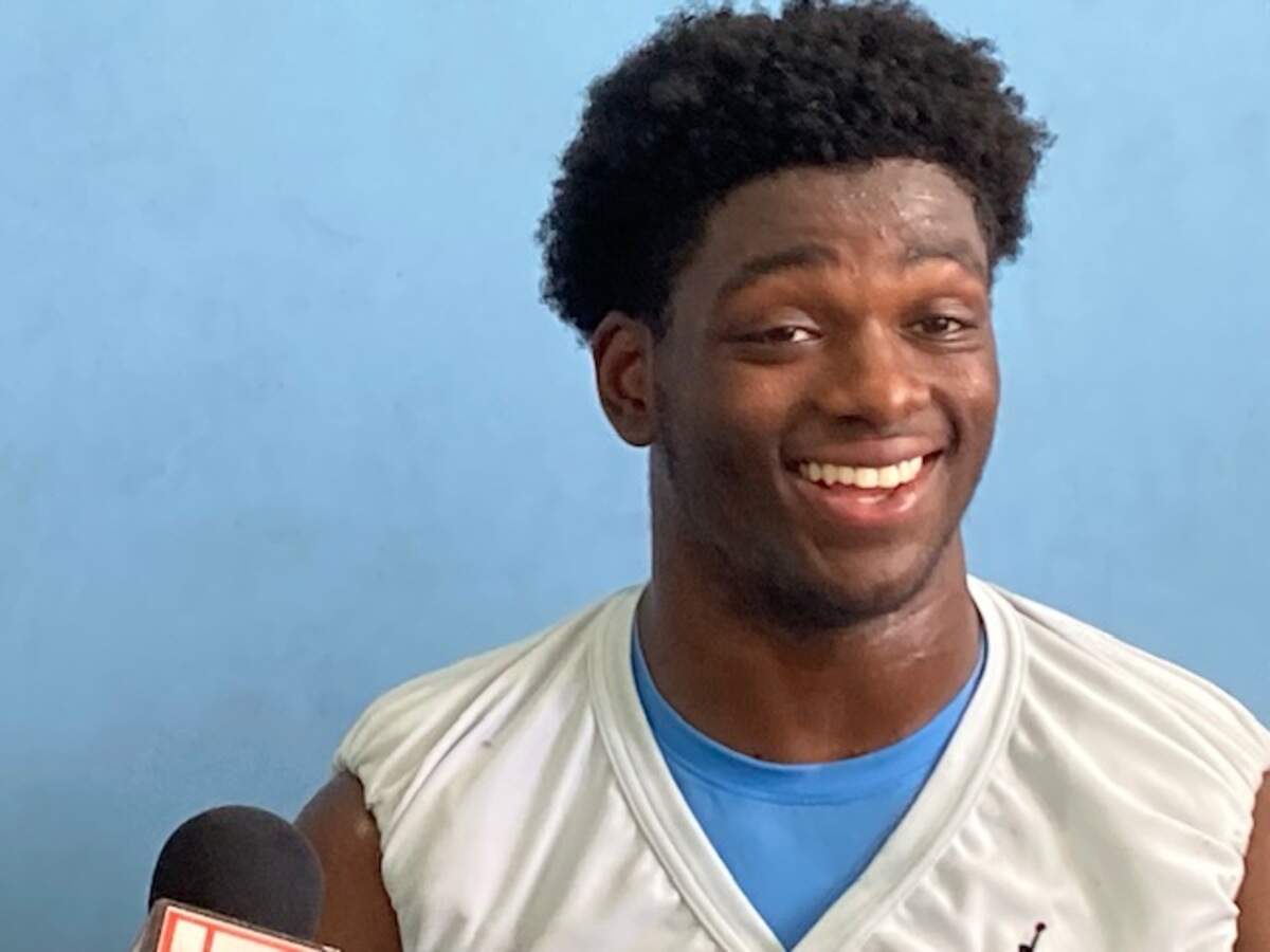 North Carolina defensive back Kaleb Cost answers media questions after fall football practice on Aug. 12, 2024.