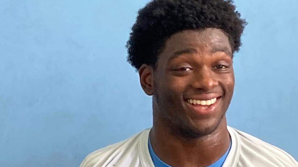North Carolina defensive back Kaleb Cost answers media questions after fall football practice on Aug. 12, 2024.