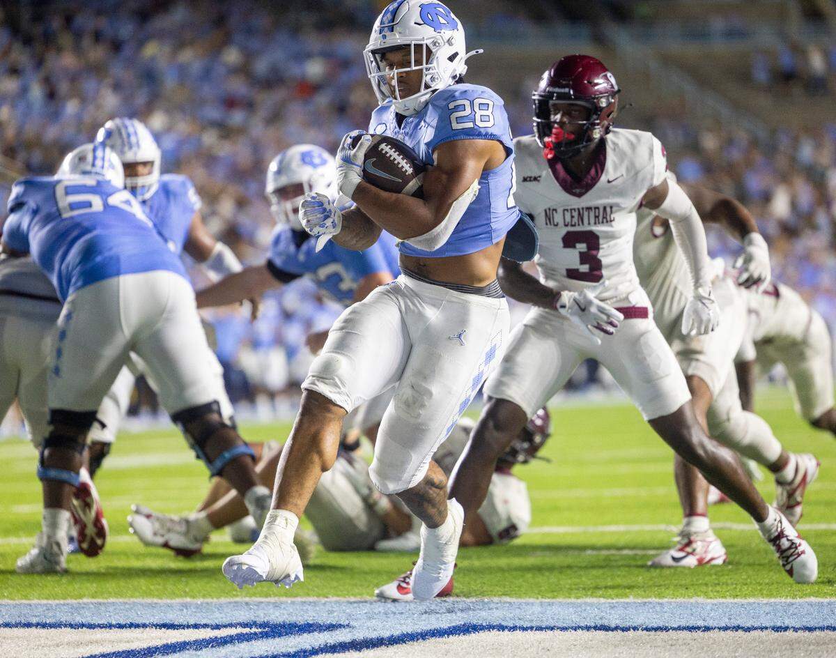 North Carolina running back Omarion Hampton (28) scores a touchdown on a 4-yard run in the fourth quarter to give the Tar Heels a 31-10 lead over N.C. Central on Saturday, September 14, 2024 at Kenan Stadium in Chapel Hill, N.C.