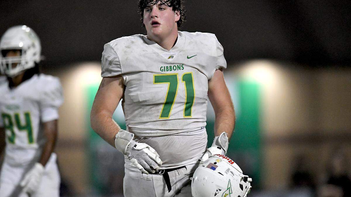 Cardinal Gibbons offensive tackle Jack Sheehan (71) walks to the sidelines after losing his helmet after a play against Leesville Road during the second half. The Leesville Road Pride and the Cardinal Gibbons Crusaders met in a conference football game in Raleigh, N.C. on November 1, 2024.