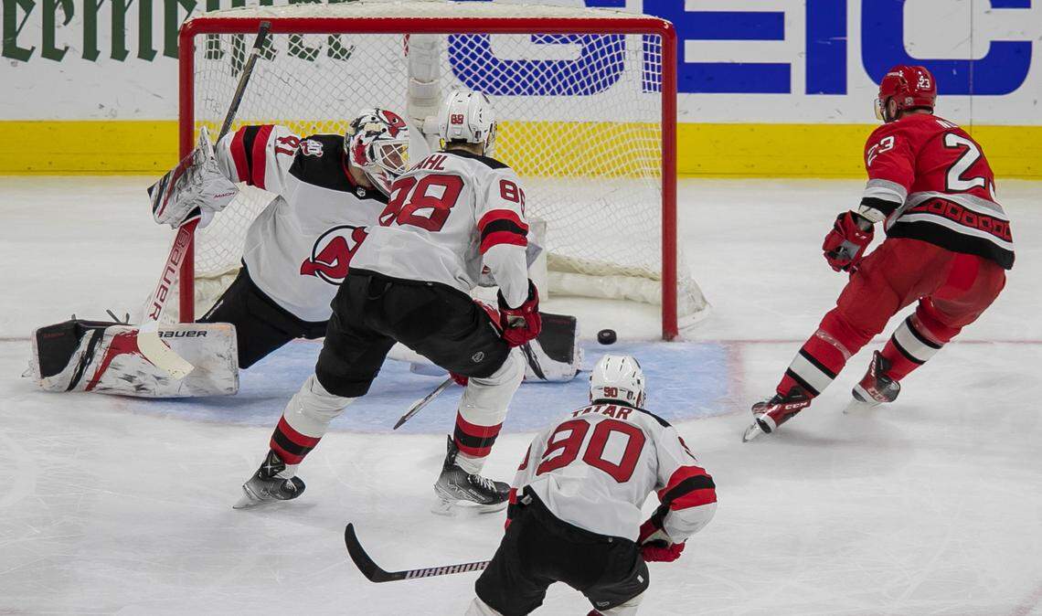 The Carolina Hurricanes Stefan Noesen (23) scores on New Jersey Devils Vivek Vanecek (41) to cap a 6-1 victory in the third period during Game 2 of their second round Stanley Cup playoff series on Friday, May 5, 2023 at PNC Arena in Raleigh, N.C.