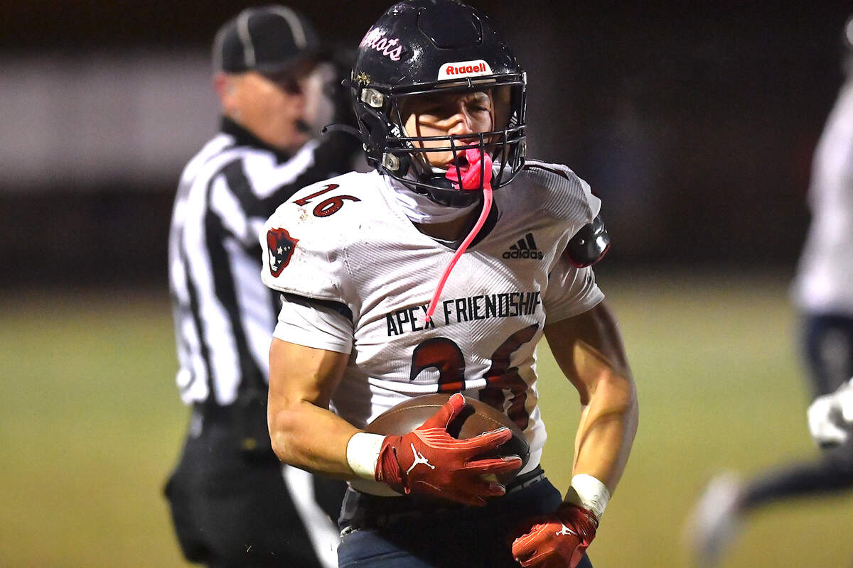 Apex Friendship’s Jaden Avery (26) reacts after the long run in the first half. The Apex Friendship Patriots and the Durham Jordan Falcons met in the second round of the NCHSAA 4A playoffs in Durham, N.C. on November 22, 2024.