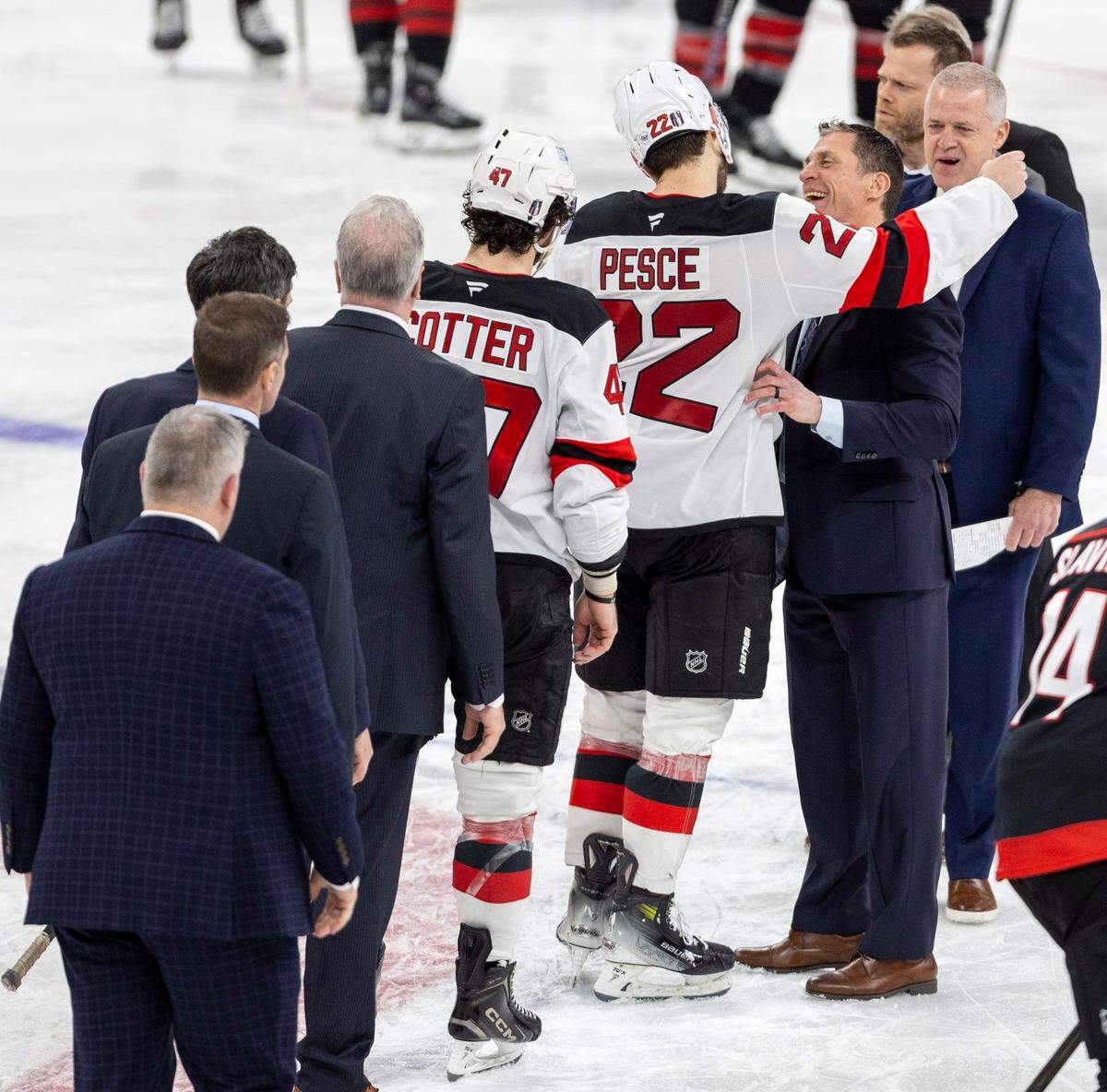 Carolina Hurricanes coach Rod Brind’Amour embraces former Carolina Hurricane, New Jersey Devils’ defenseman Bret Pesce (22) following the Hurricanes’ 5-4 victory on Tuesday, April 29, 2025 at Lenovo Center in Raleigh, N.C.