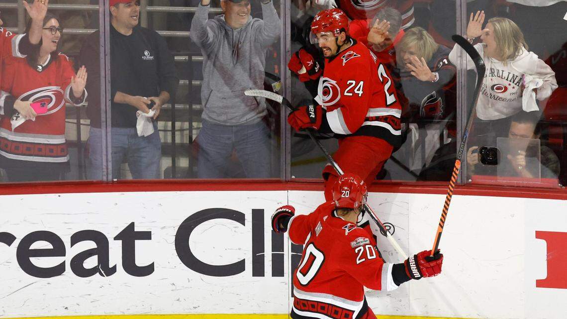 Carolina center Seth Jarvis (24) celebrates after scoring during the first period of the Hurricanes’ game against the Panthers in the first game of Eastern Conference Finals at PNC Arena in Raleigh, N.C., on Thursday, May 18, 2023. Carolina center Sebastian Aho (20) comes in to join him.