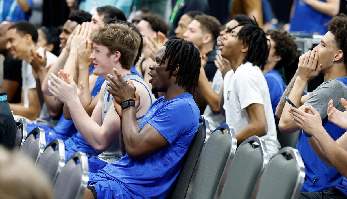 The Duke team applauds after Cooper Flagg was announced as the AP National Player of the Year during a press conference at the Alamodome in San Antonio, Texas, Friday, April 4, 2025. Duke faces Houston Saturday in the national semifinal.