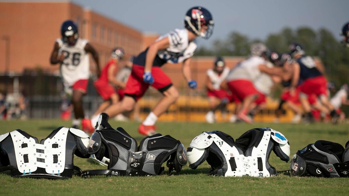 Apex Friendship football players work out on ‘No sweat Wednesdays’, a day without pads on September 11, 2019 in Apex, N.C. Coach Adam Sanders has instituted a no contact practice after a visit to Dartmouth, which uses a similar system. Apex Friendship has fewer injuries and players are in better shape to play at their potential on game nights.