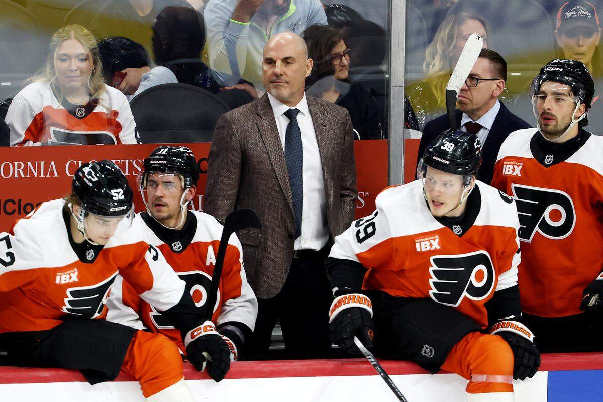 Philadelphia Flyers head coach Rick Tocchet watches from the bench during the third period against the Washington Capitals at Xfinity Mobile Arena on March 11, 2026 in Philadelphia, Pennsylvania.