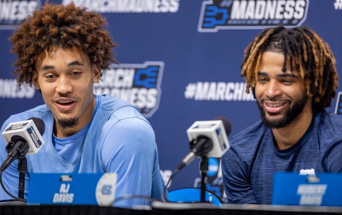 North Carolina guard Seth Trimble (7) shares the dais with teammate R.J. Davis as he talks about recommending Milwaukee restaurants for a team meal during media availability ahead of their NCAA first round game against Ole Miss on Thursday, March 20, 2025 at Fiserv Forum in Milwaukee, Wisconsin.